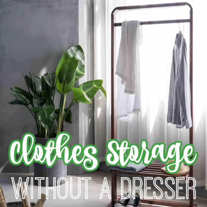 rack with clothes hanging in front of window with white curtains with title text overlay reading Clothes Storage Without A Dresser