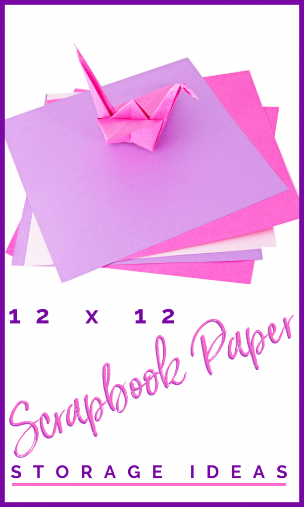 stack of pink and purple scrapbook paper with pink origami crane on top