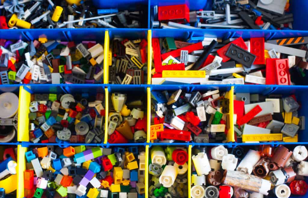 overhead view of LEGO bricks organized in compartments.