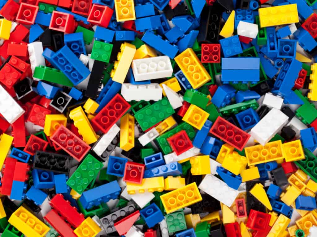 pile of LEGO bricks in different colors and sizes.
