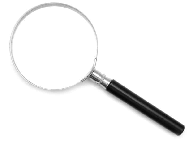 magnifying glass with black handle on white background.