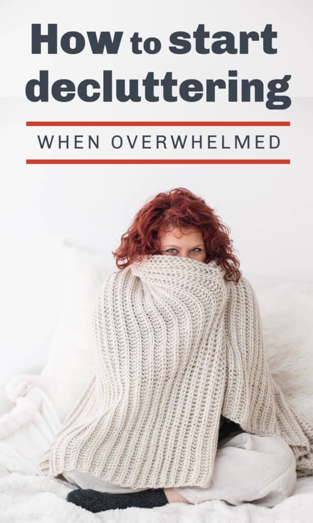 red head woman with sweater up around her face