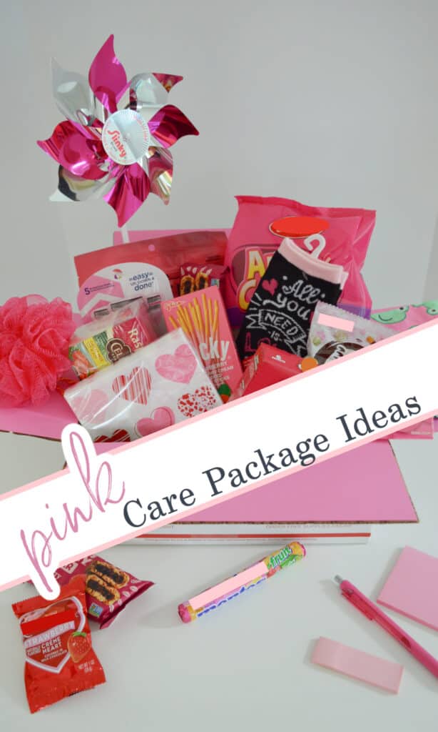 overhead view of pink box filled with pink themed gift items