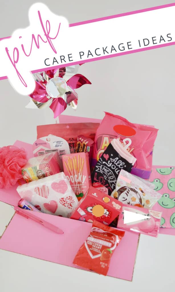 overhead view of pink box filled with pink themed gift items in care package