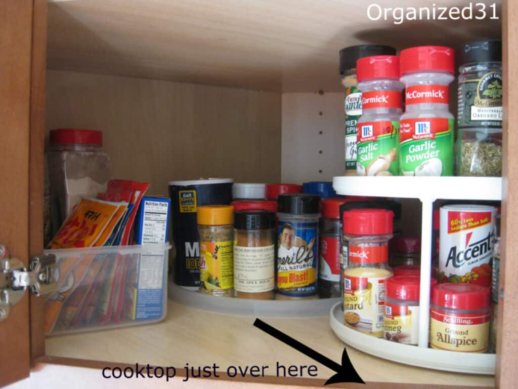 lazy Susan and spices in corner kitchen cabinet.