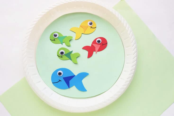 close up of paper plate craft with colorful fish.