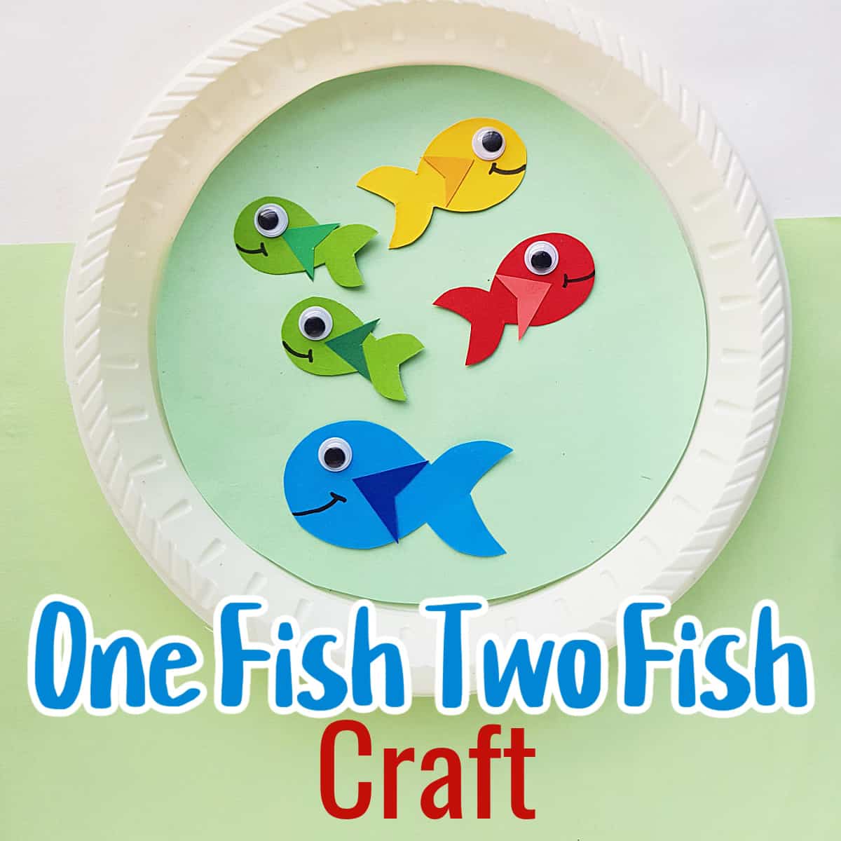 close up of paper plate craft with colorful fish.