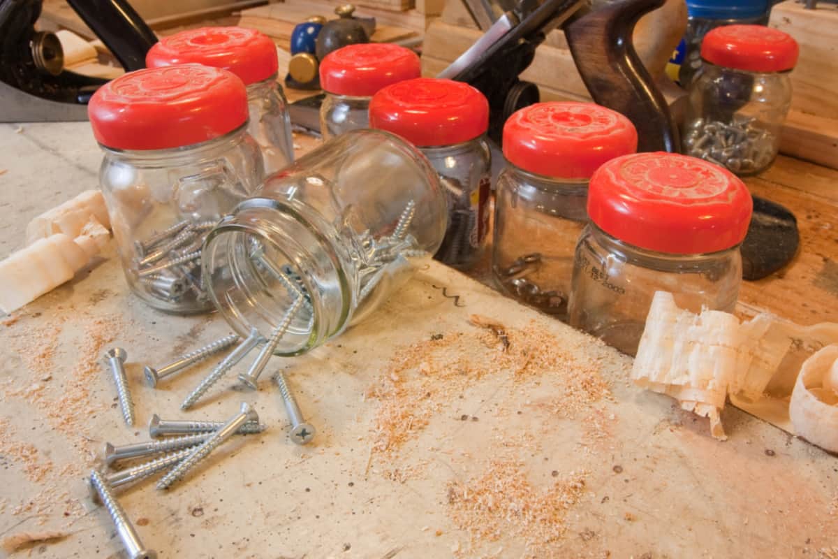 The jars are filled with screws.